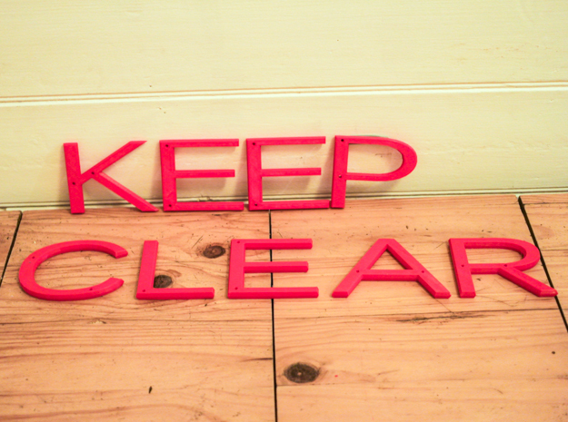 Keep Clear sign in Red Processed Versatile Plastic